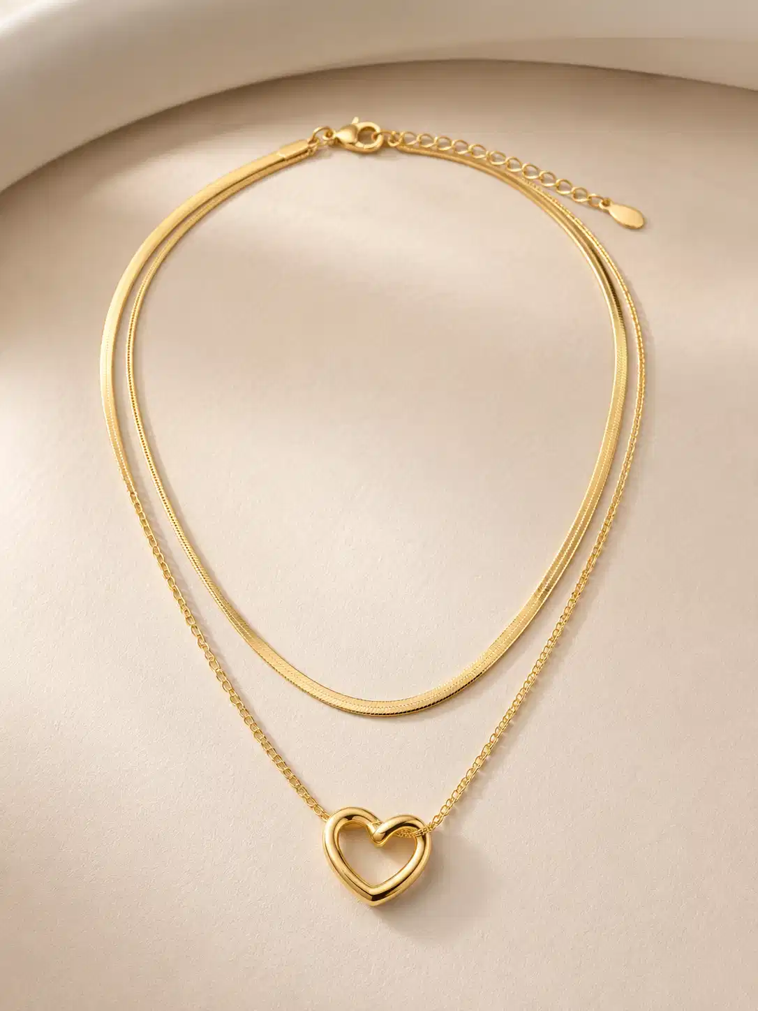 Amora Duo gold-tone heart layered necklace with a snake chain, fine-link chain and adjustable lobster clasp
