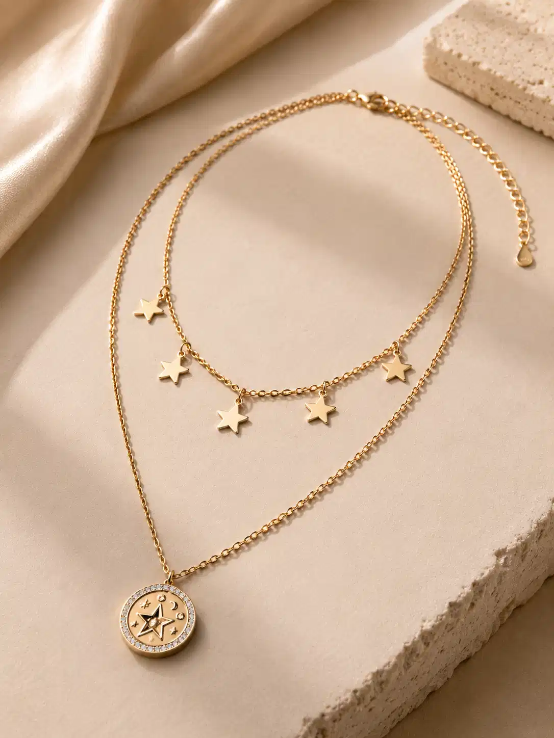 Full Lunara double-layer gold-tone necklace with five star charms, celestial pendant and adjustable extension chain