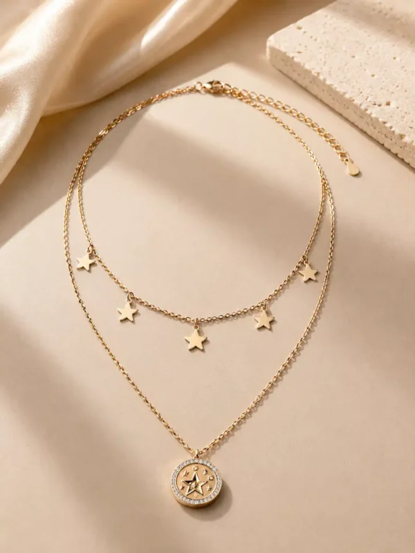 Alternate view of the Lunara celestial layered necklace with gold-tone stars and round crystal-style pendant