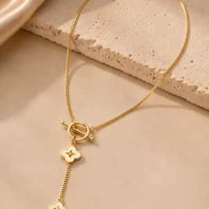 Full Fiora gold-tone floral Y necklace with ivory flower charms, fine link chain and graduated drop