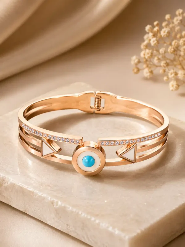 Veyra rose-gold-tone geometric hinged bangle with a turquoise-blue centre and ivory triangle details