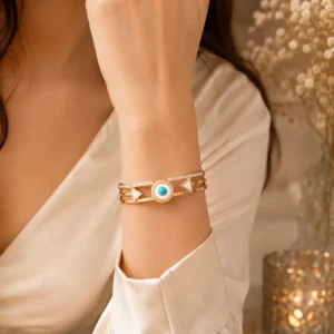Woman wearing the Veyra turquoise geometric bangle with a white professional outfit