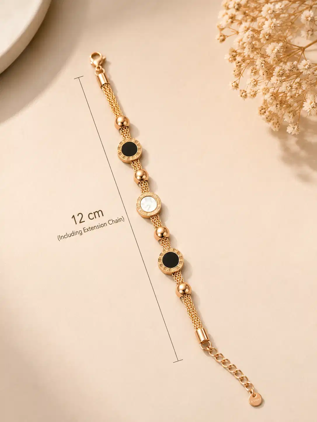 Mirelle multi-strand bracelet displayed with its lobster clasp, extension chain and bracelet measurement guide