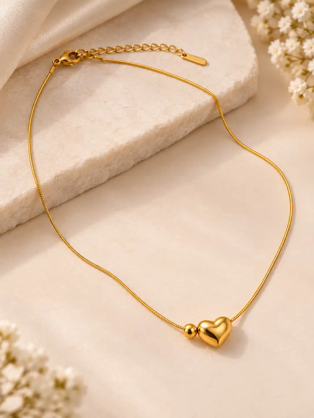 Adjustable gold-tone heart necklace with 3D heart charm, bead detail, lobster clasp and extension chain
