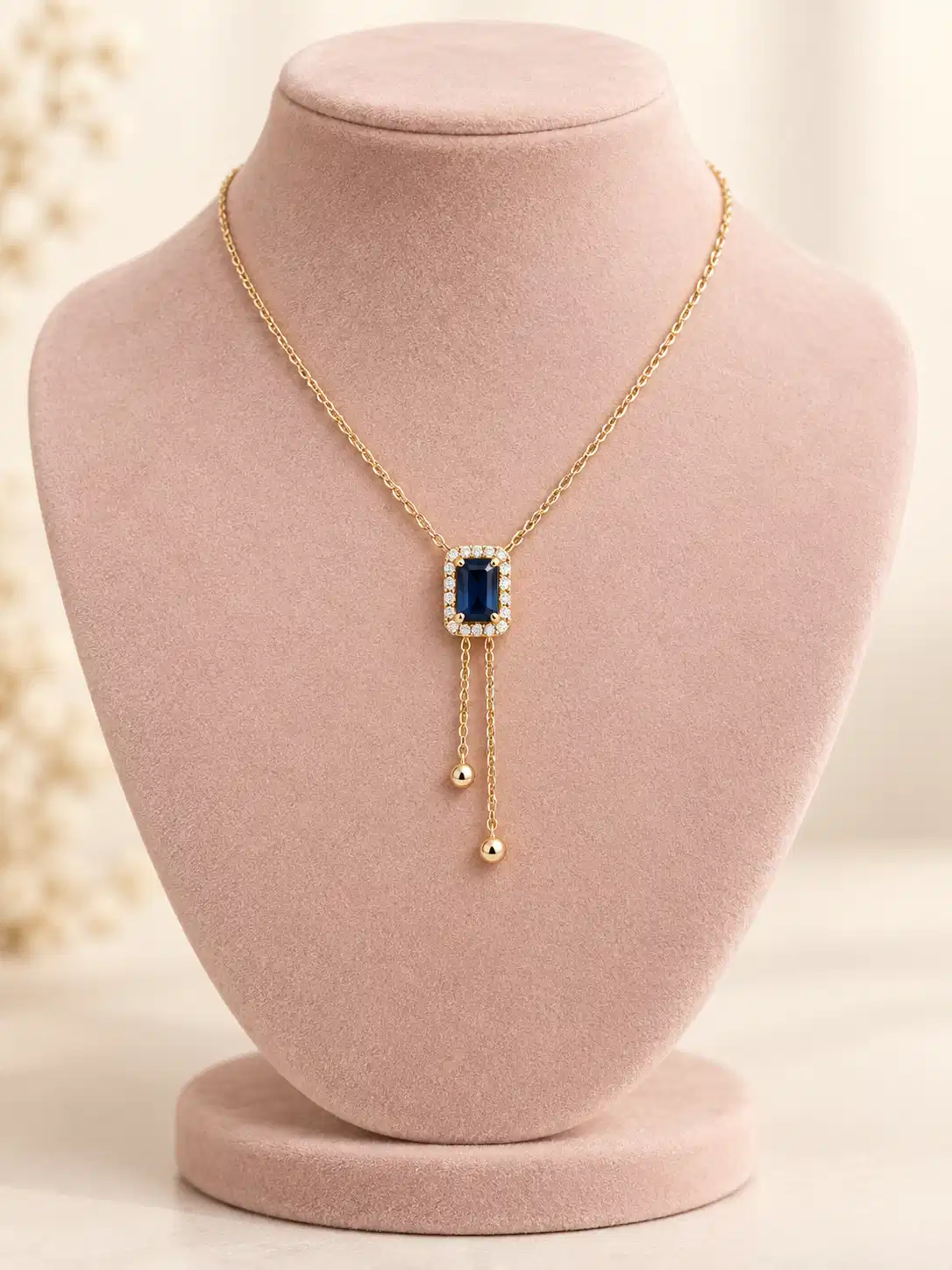 Blue Hour Y-Drop Necklace with deep blue rectangular stone, crystal halo and gold-tone double drop design by Orika Jewels