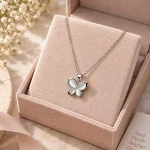 Luna Glow silver butterfly pendant necklace displayed in jewellery gift box with luminous white wing design