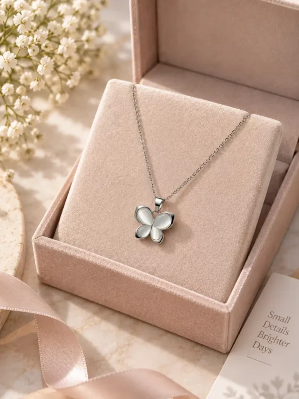Luna Glow silver butterfly pendant necklace displayed in jewellery gift box with luminous white wing design