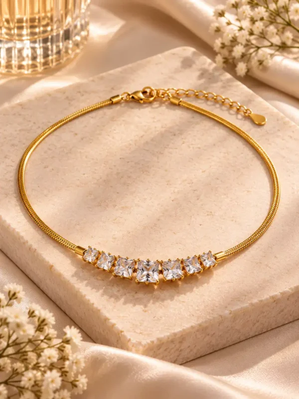 Gold-tone crystal necklace for women with seven graduated square-cut clear stones and adjustable chain