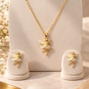 Aurelia gold tone fairy pendant necklace and matching earrings with translucent ivory wings and crystal-style detailing