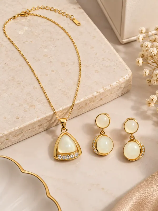 Gold-tone pendant necklace and ivory drop earrings set with lobster clasp and extender chain