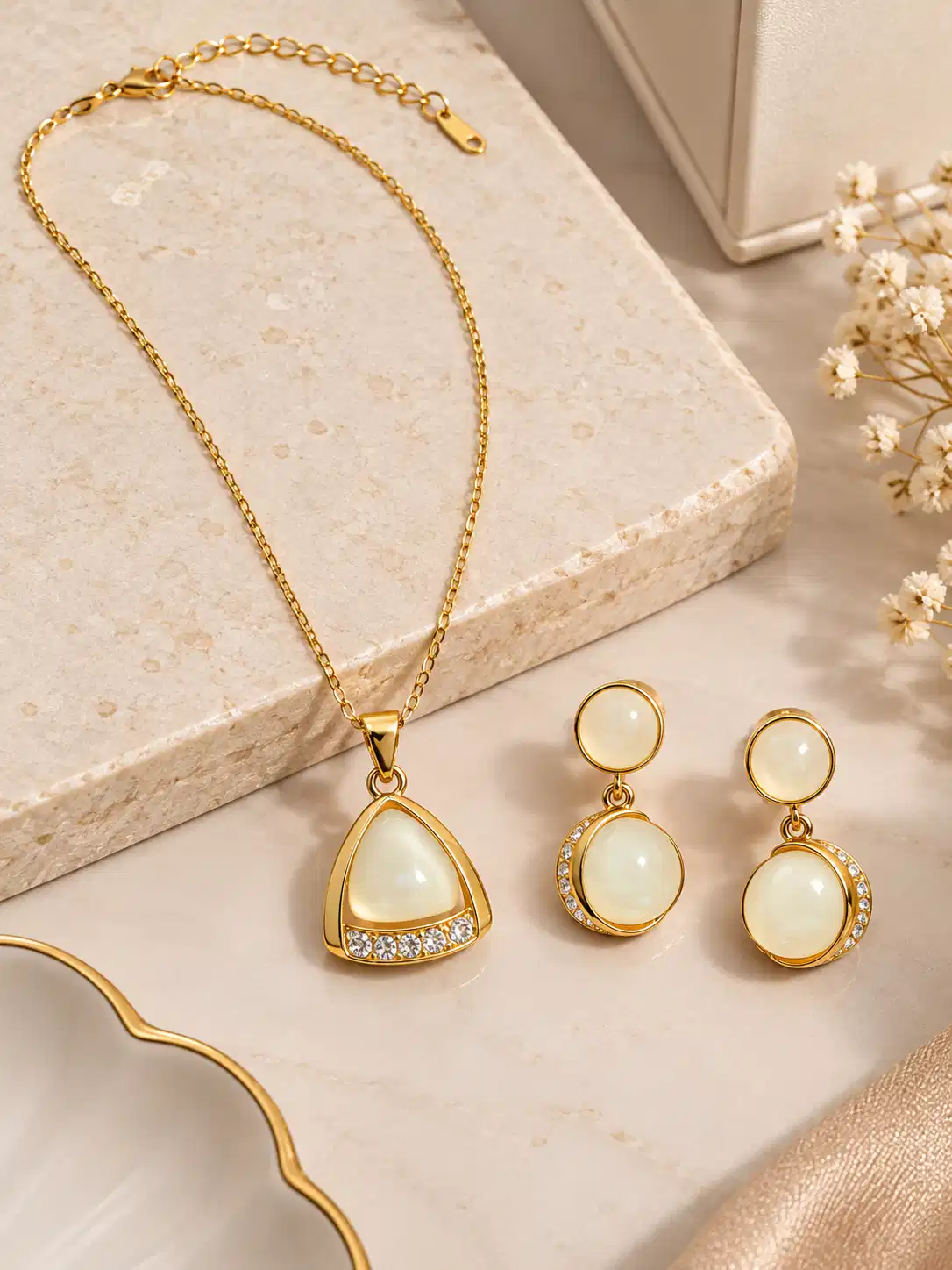 Gold-tone pendant necklace and ivory drop earrings set with lobster clasp and extender chain