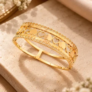 Amora gold heart lattice statement bangle for women with alternating solid and open heart motifs