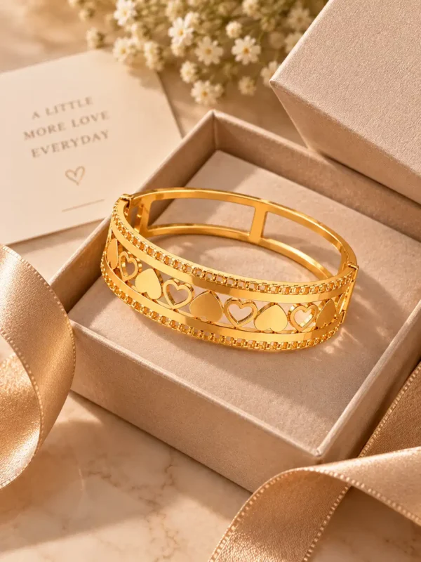 Amora gold heart lattice bangle for women displayed in a premium jewellery gift box